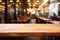 Wooden cafe table amid abstract, defocused coffee shop interior ambiance