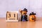 Wooden calendar block disrupted show date 31 october halloween day and toy pumpkin on wooden background. Halloween concept