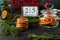 Wooden calendar with date 25 December, Christmas decor, orange chips on wooden background, front view