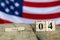 Wooden calendar with date on the background of the USA flag. Template for writing the dates of the national holidays of America