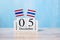 Wooden calendar of December 5th with miniature Thailand flags. Thai Nation Day and fatherâ€™s day concepts