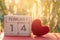 Wooden calendar show of February 14 with pink heart. Valentine`s Day, or St Valentine`s Day