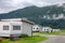 Wooden camping cabins with camper trailers at a campsite in Norway Scandinavia