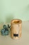 Wooden candle holder rustic interior centerpiece with candles in a cozy barn setting.