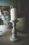 Wooden candlestick with white candle