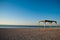 Wooden canopy awning gazebo by the sea beach sand morning
