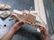 Wooden car close-up with hands of the master