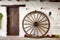 Wooden cartwheel and door in andalusian patio