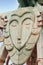 Wooden carved sculpture Face with closed eyes outdoor