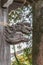 Wooden carved Shishi Lion Nosing ornament of Chozuya or Temizuya (Water ablution pavilion) at Suzukamyo Shrine.