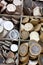 Wooden cashbox full of pound sterling coins