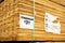 Wooden cedar pickets in polyester strapping, price tag, full pallet packaging at hardware home improvement store, Dallas, Texas,