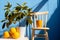 a wooden chair next to a potted lemon tree