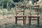 Wooden chair, wooden chair twin, Pair old wooden chair outdoors. Around the lush grass, The environment offers privacy.