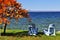 Wooden chairs on autumn lake