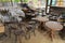 Wooden chairs stacked on tables. Local restaurant temporarily closed during lockdown COVID-19 or coronavirus outbreak pandemic.