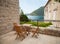 Wooden chairs and table on seaside terrace