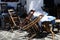 Wooden chairs at a taverna in Milos island, Greece