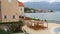 Wooden chaise lounges by the sea. Hotel in Kotor Bay in Monteneg