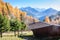 Wooden chalet in a colourful Autumnal panorama In Italy