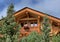 Wooden chalet traditional alpine architecture in pine trees