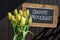 Wooden chalkboard happy birthday Sign beautiful yellow tulips bucket spring flowers tulip brown background