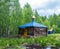 Wooden chapel with a Golden dome on the sacred source Stream.