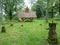 Wooden chapel at the old cemetery surrounded by beautiful old tombstones and crosses.