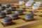 Wooden checkerboard with checkers spaced on table closeup