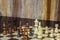 Wooden chess Board and chess pieces in in the game