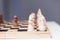 Wooden chess on a chessboard. The concept of progress, investment, responsibility and risk in a financial game