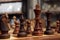Wooden chess figures. Closeup on chess board and dark figures.