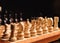 wooden chess pieces on the chess desk. White figures