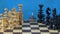 Wooden chess pieces on chessboard and whirligig humming-top