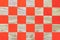 Wooden chessboard with orange cells. Checkerboard background