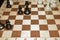 Wooden chessboard under black chessmen for leisure theme