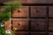 Wooden chest of drawers with small drawers and round handles for storing dishes and menus in an outdoor cafe. Decorative element