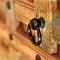 a wooden chest made of recycled old ship planks with rivets and metal rings