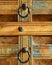 a wooden chest made of recycled old ship planks with rivets and metal rings