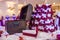 Wooden chest on the table with a violet tablecloth and small gifts for guests from the newlyweds