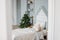 The wooden children bed with pillows and toys. Minimalistic Christmas decor. Scandinavian interior