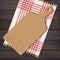 Wooden chopping board with gingham cloth