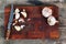 Wooden chopping board with knife and peeled garlic
