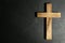 Wooden Christian cross on slate table, top view with space for text. Religion concept