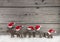 Wooden christmas background with a group of santa clause on wood