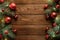 Wooden Christmas background with red balls decoration, lights, Christmas tree branches. Xmas postcard, New Year greeting card