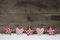 Wooden christmas background with red white checked hearts and st