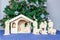 Wooden christmas stable with religious bible figurines