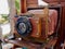 Wooden classic retro vintage camera on tripod
