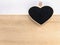 Wooden clipboard heart shape on wood board